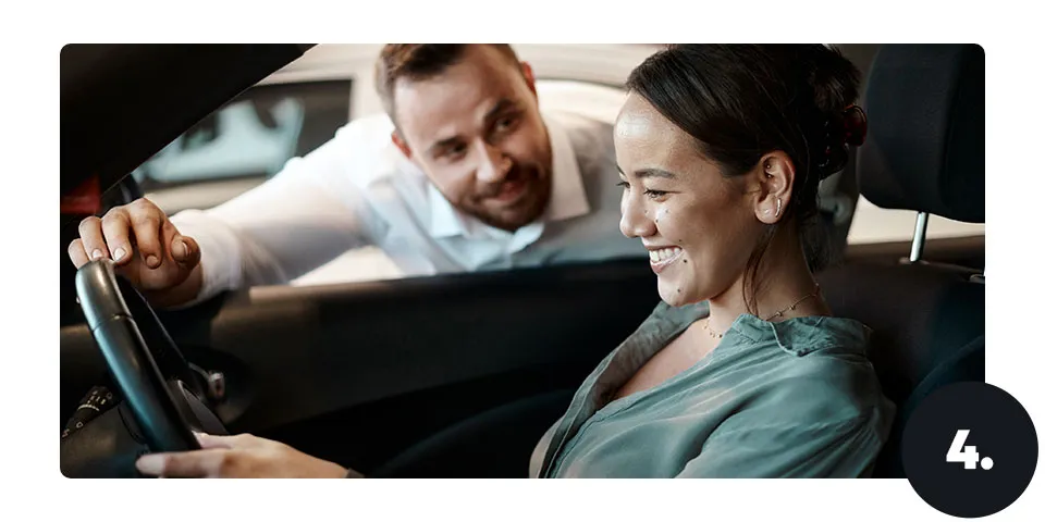 happy woman inside a car 